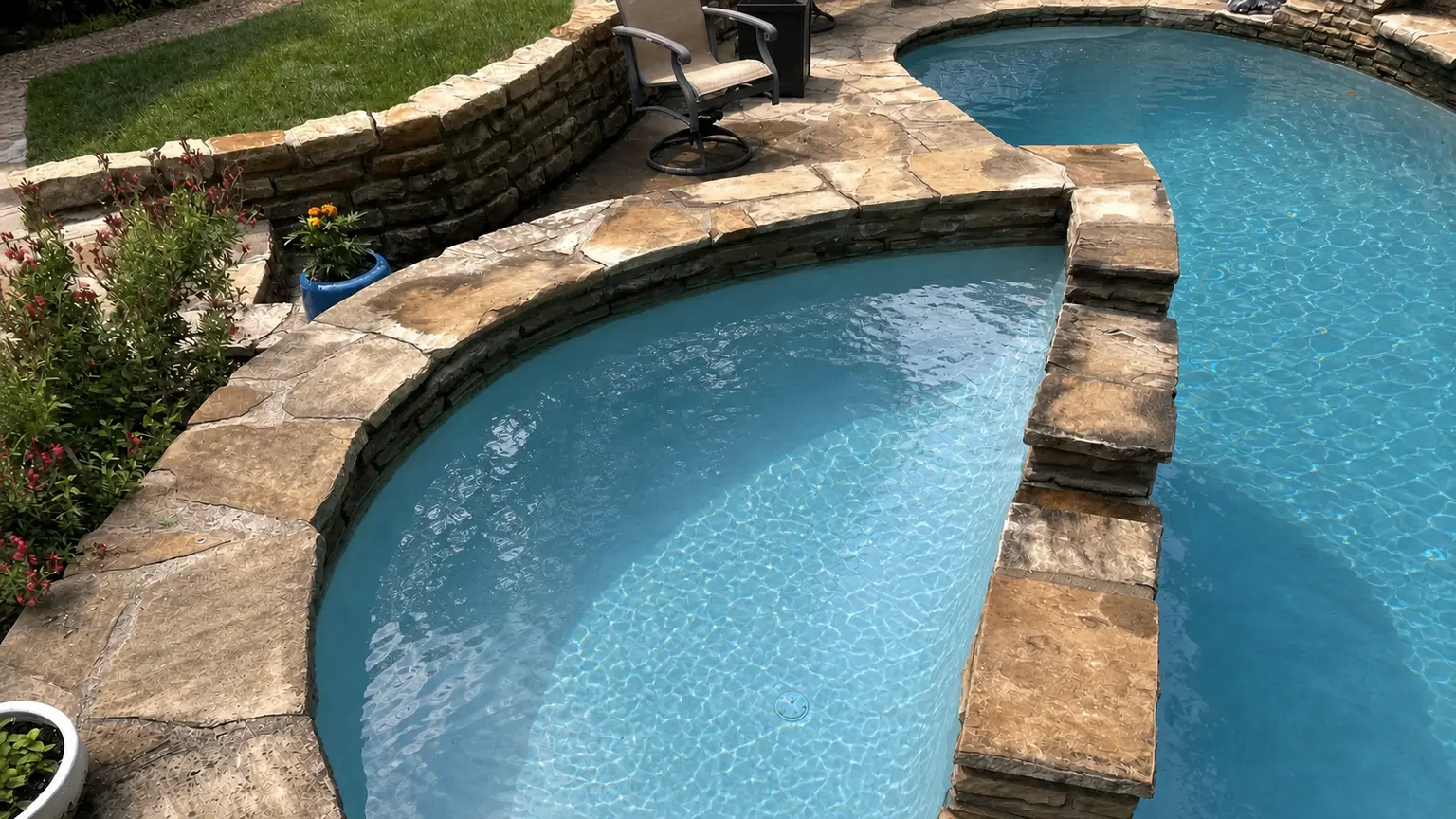 Freeform pool with limestone coping and clear blue water after a True Texan Pools service visit in Dallas-Fort Worth