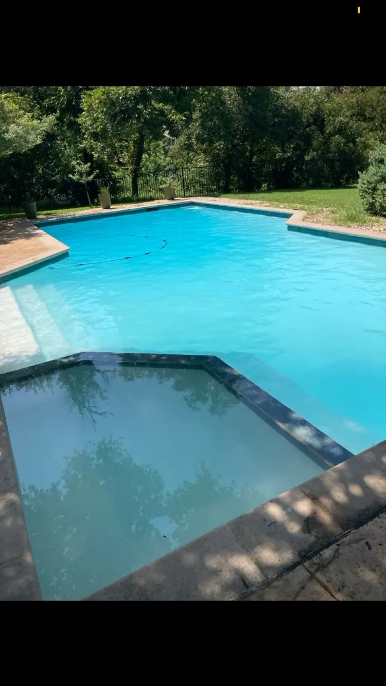 Geometric pool with a square spa, water clear and blue