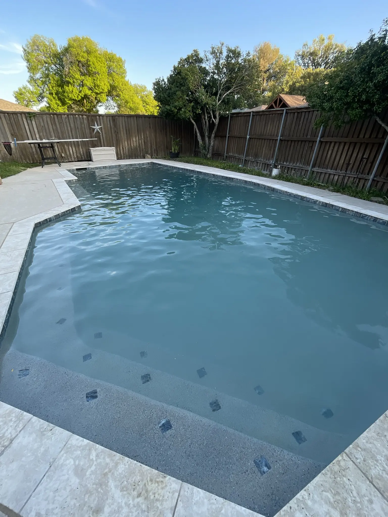 Octagonal pool with clear water after service